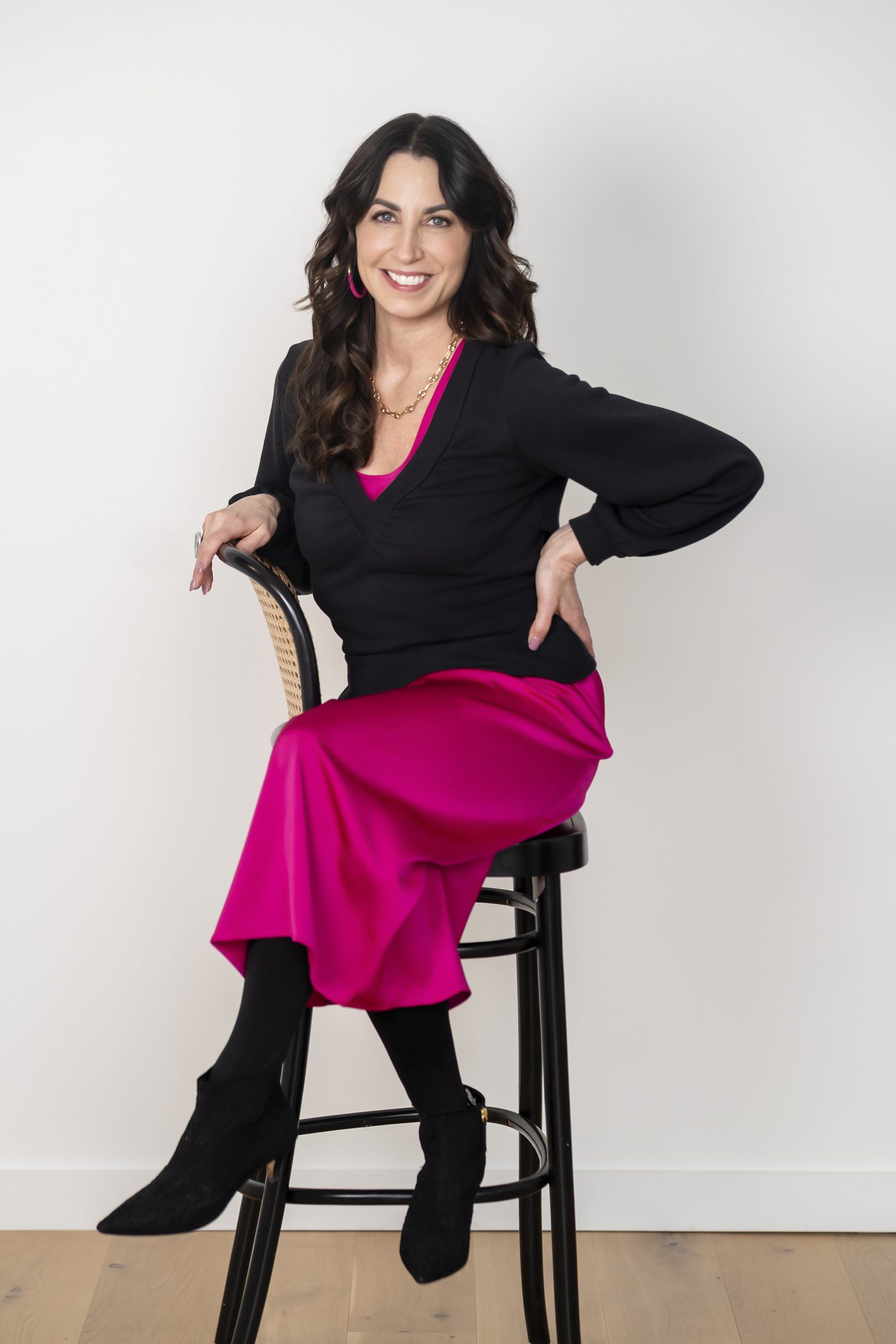 Susan Page seated on a stool